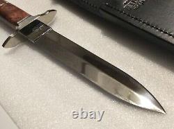 #94/100 Custom U. S. A. Buck Burl Wood Dagger (knife) B876-sp-0. 12/15/04 Sticker