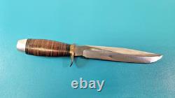 Grand poignard de combat EIG Cutlery, Italie, manche en rondelles de cuir empilées, vers les années 1950, TR1955